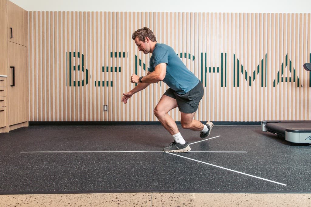 Member completing a functional movement assessment at Benchmark