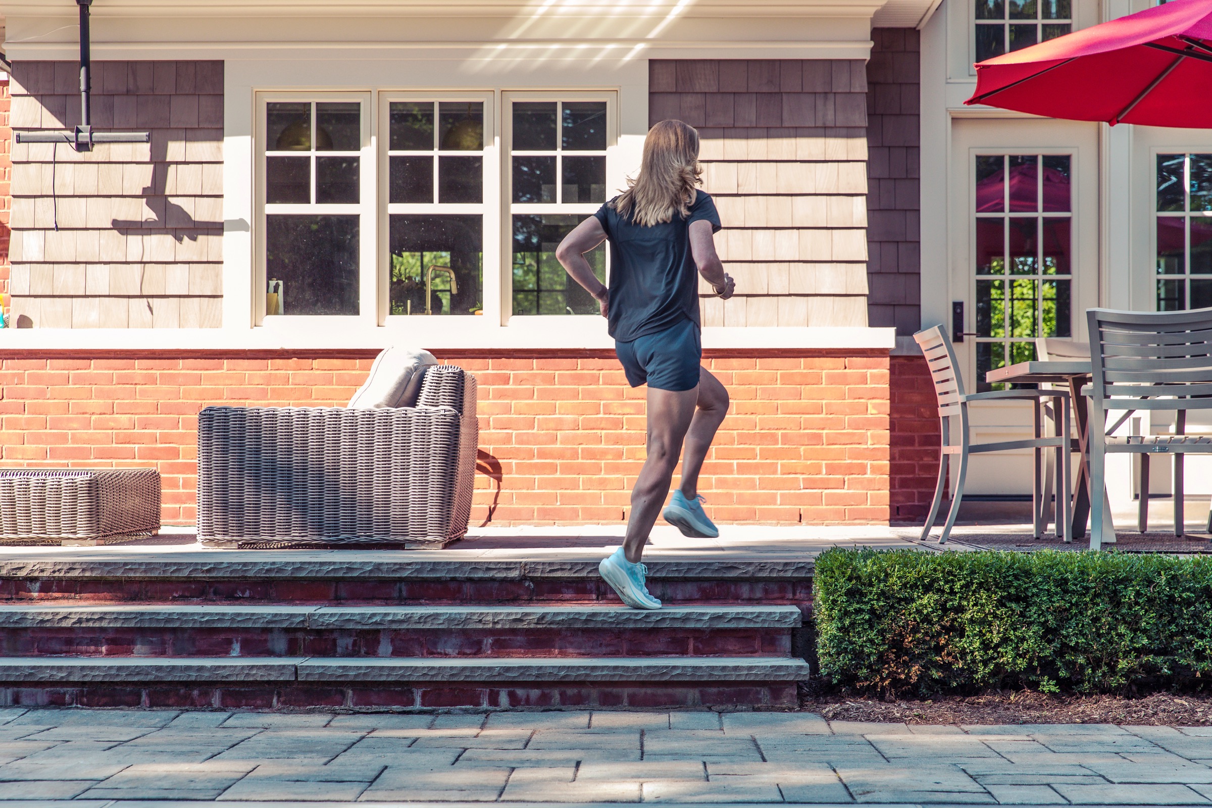Member running outdoor stairs as part of a consistent activity routine